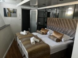 Premier cruising ship double bed cabin with en-suite bathroom.