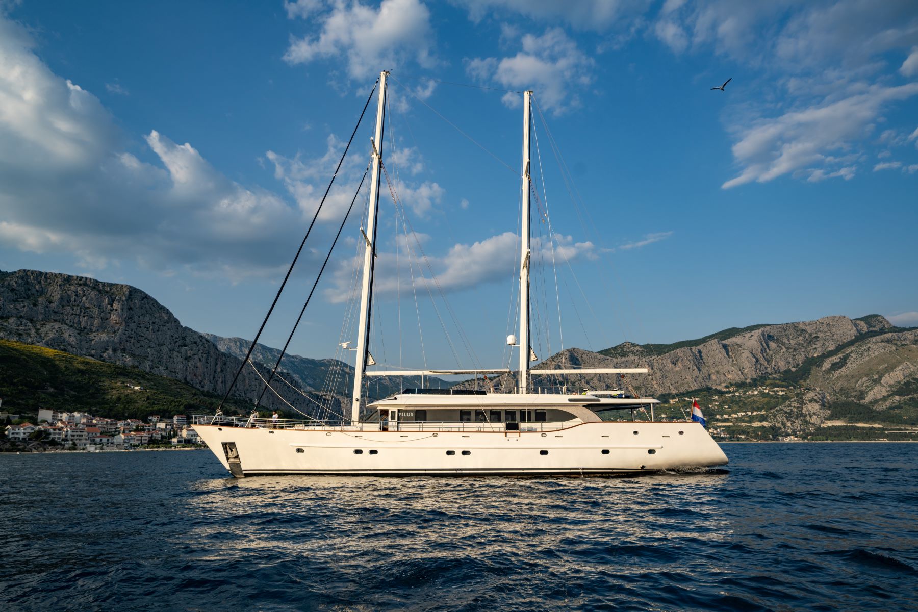 Navilux motor sailing yacht - side-view of an anchored yacht in the Adriatic Sea near Croatia's coast.
