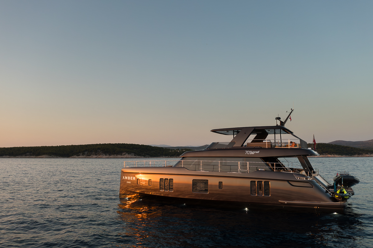 Amber One luxury catamaran - side view of an anchored yacht in the Adriatic Sea near Croatia's coast.