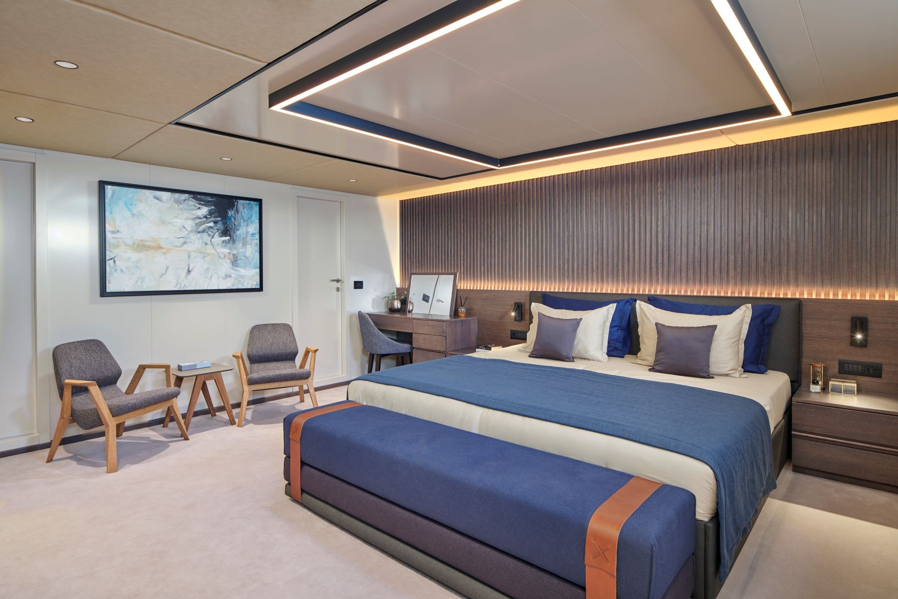 Anima Maris sailing yacht - double room with a dressing table, and 2 chairs with a small coffee table.