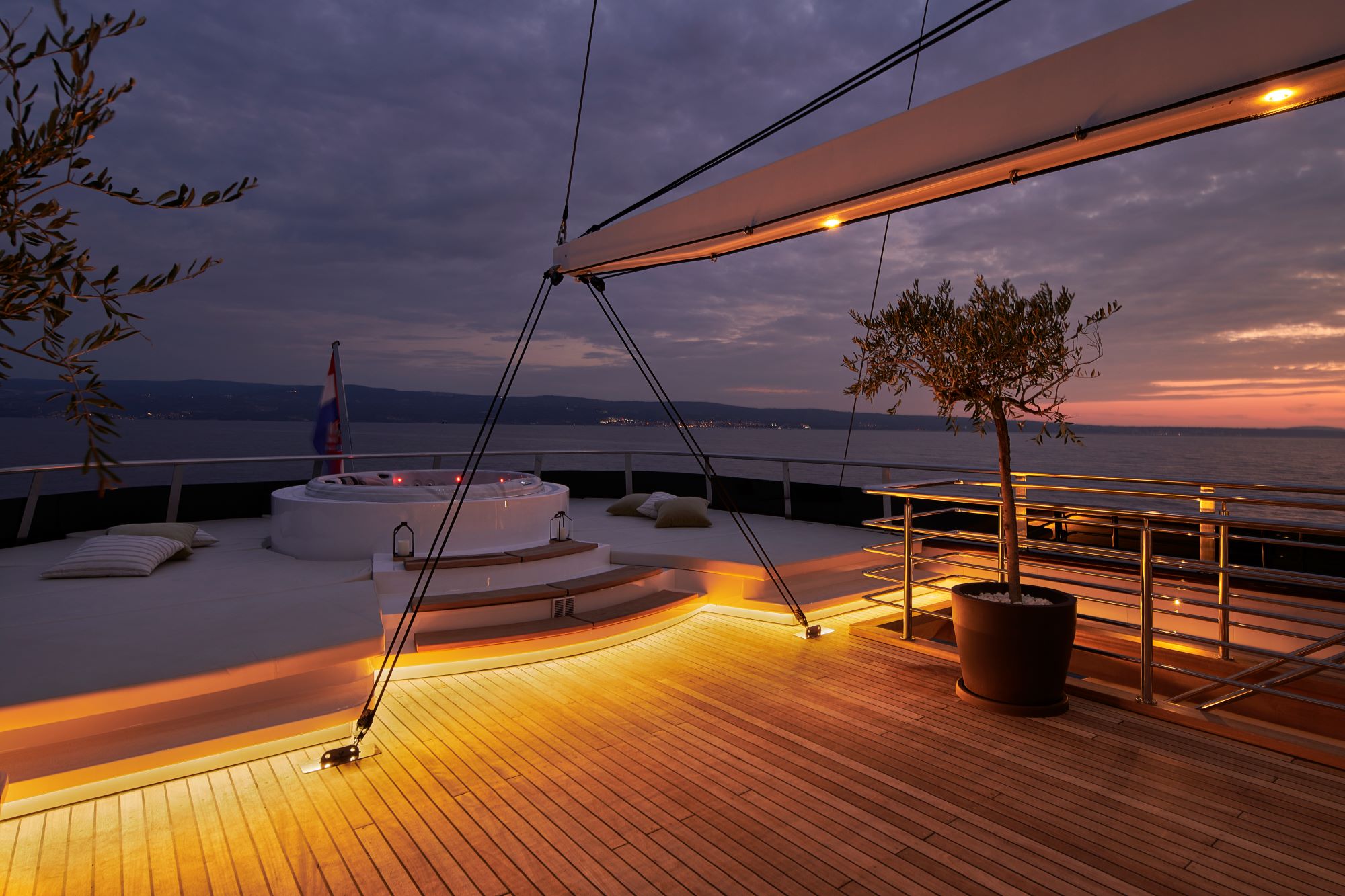 Anima Maris sailing yacht - stern sun deck big jacuzzi with big lounge area - night shot.