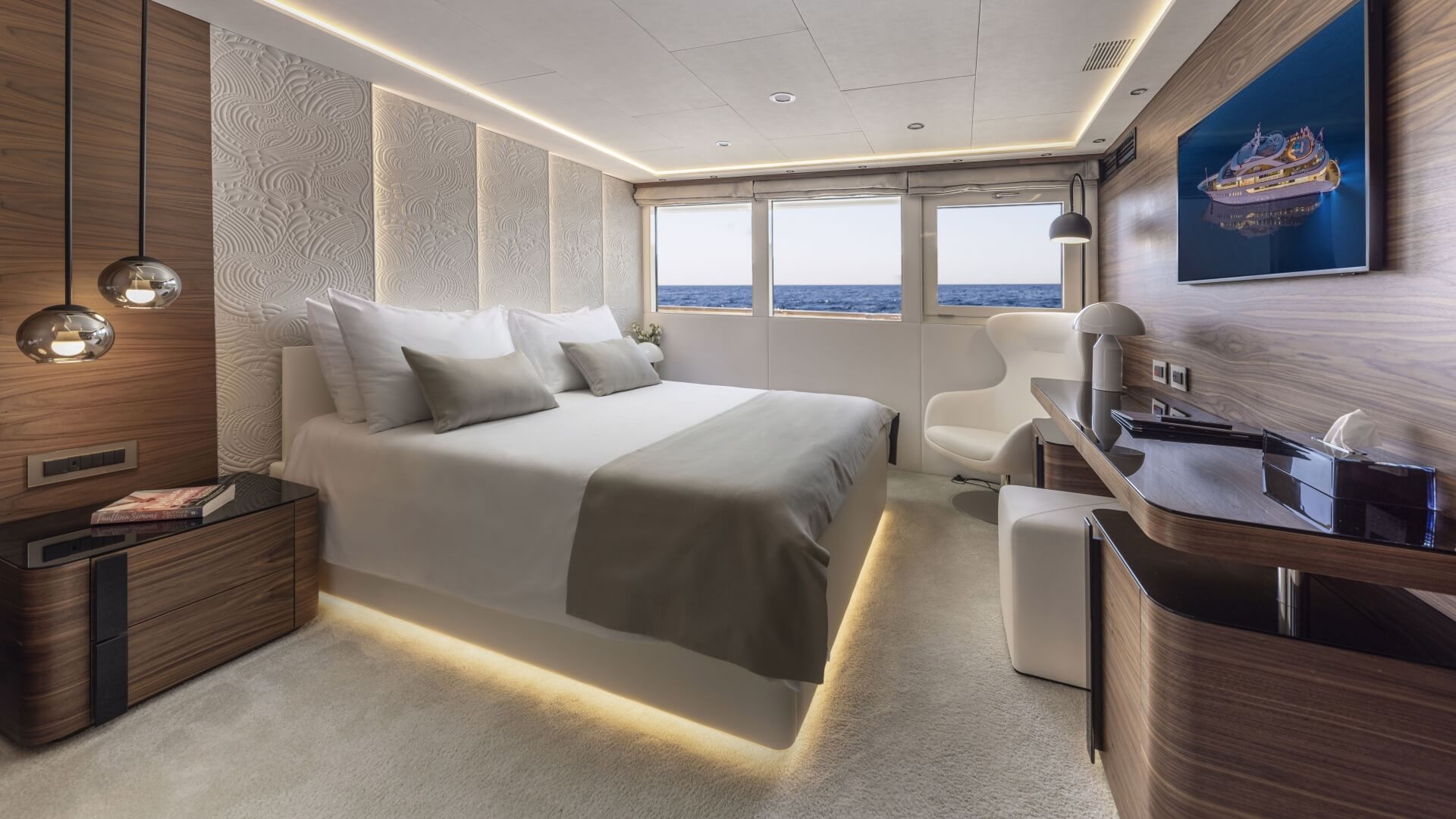 Anthea luxury yacht - cabin with a double bed, 3 big windows, a dressing table and TV.
