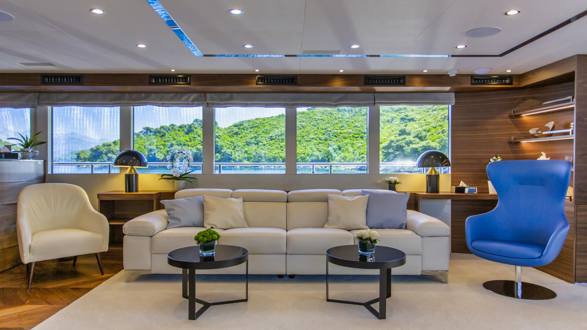 Anthea luxury yacht - small lounge area in the salon with big windows.