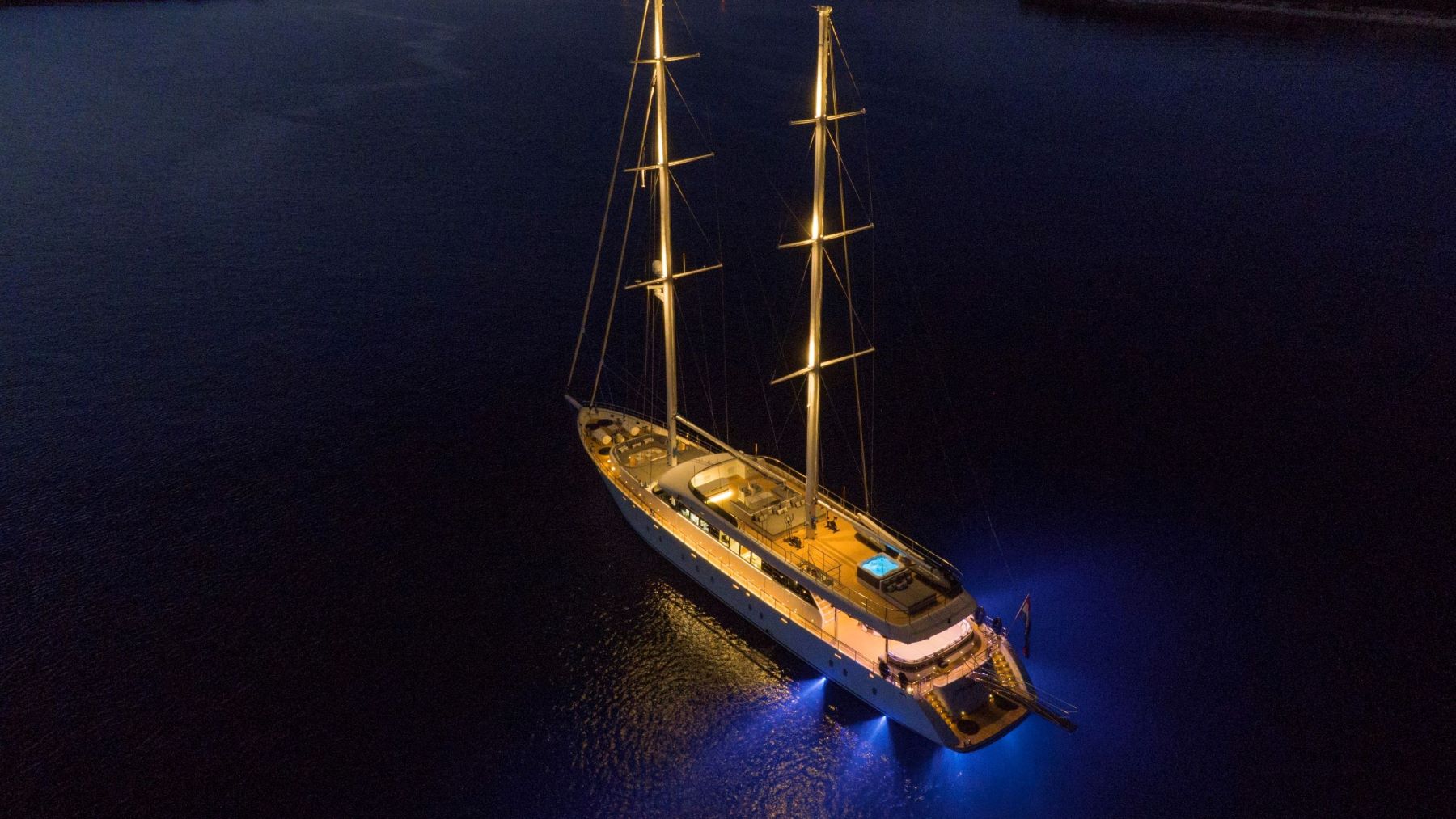 Aurum Sky sailing yacht - with lighting turned on anchored in the Adriatic Sea near the coast of Croatia - night shot.