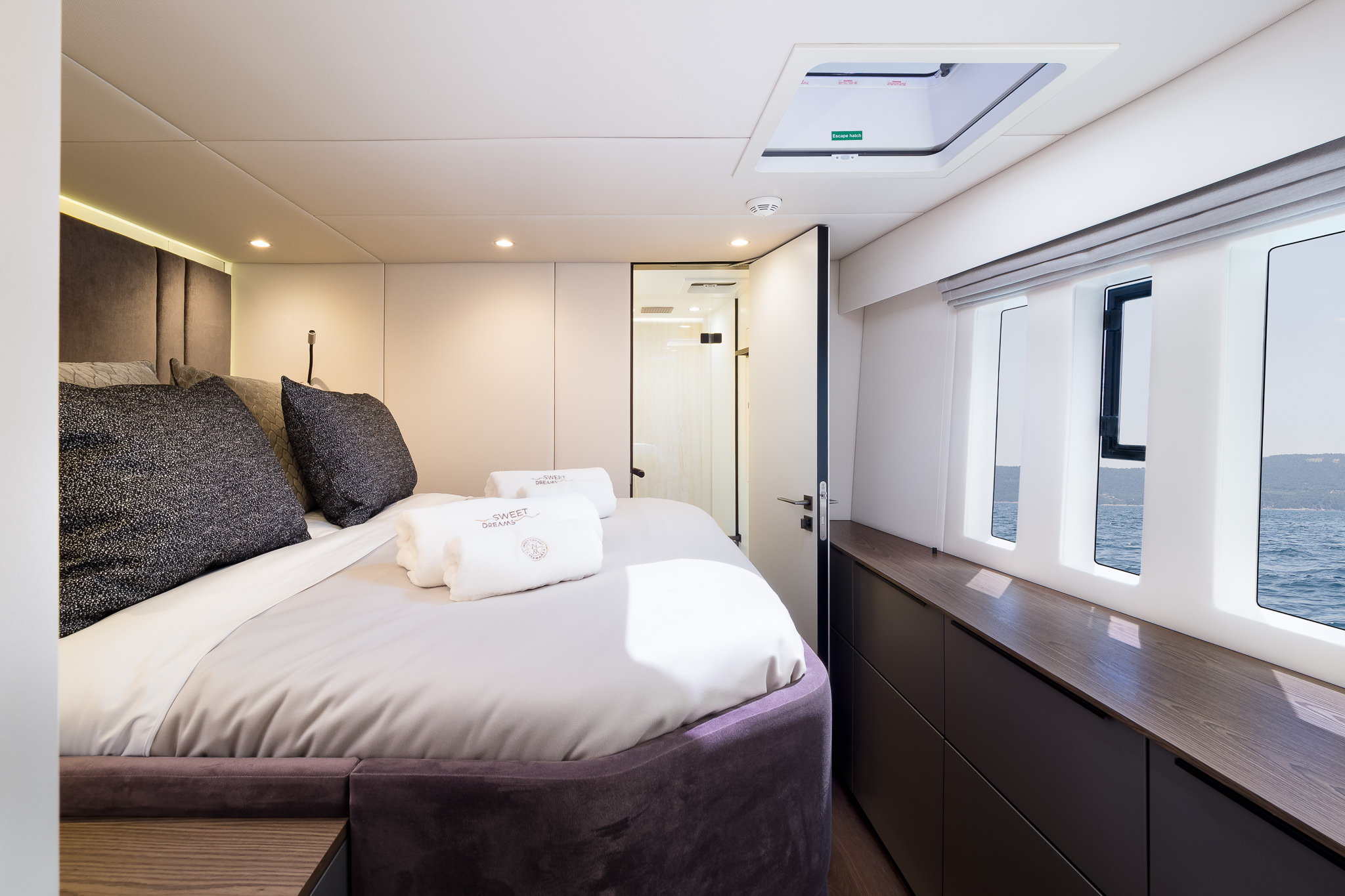 Sweet Dreams luxury yacht - cabins with a double bed, ensuite bathroom, 3 big windows, and a roof porthole - gray interior.