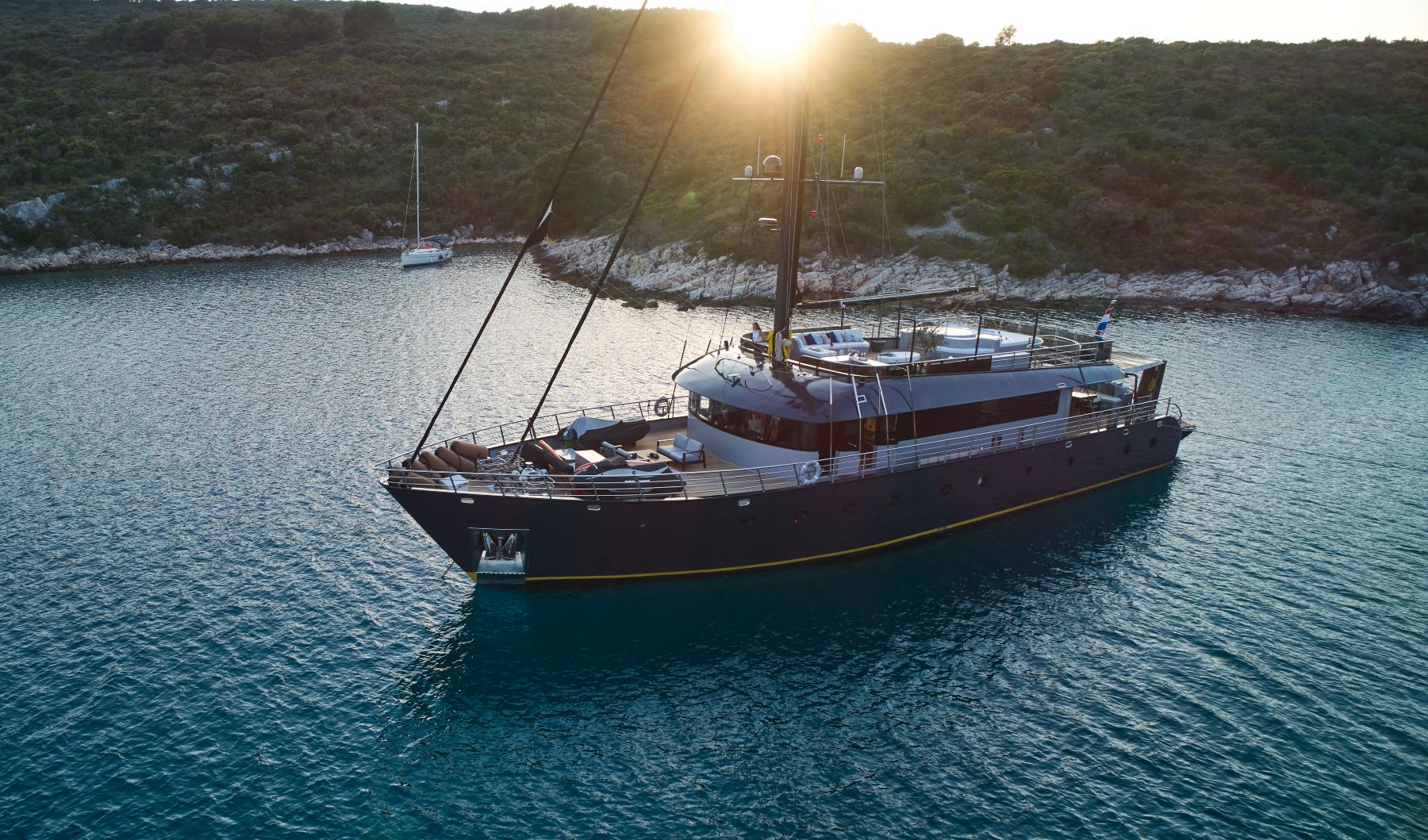 Rara Avis sailing yacht anchored in the Adriatic Sea near the Croatian coast on a sunset.