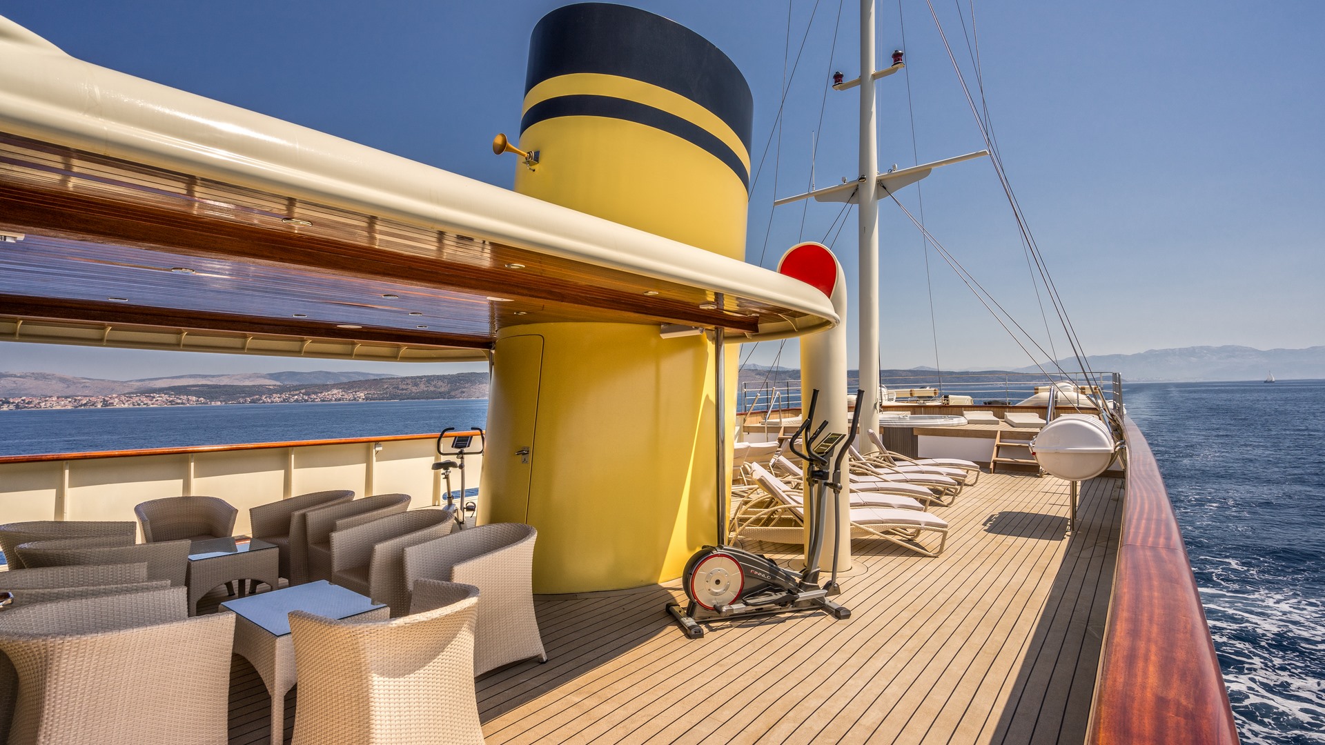 MY Casablanca yacht rear deck with sunbeds and a covered lounge area