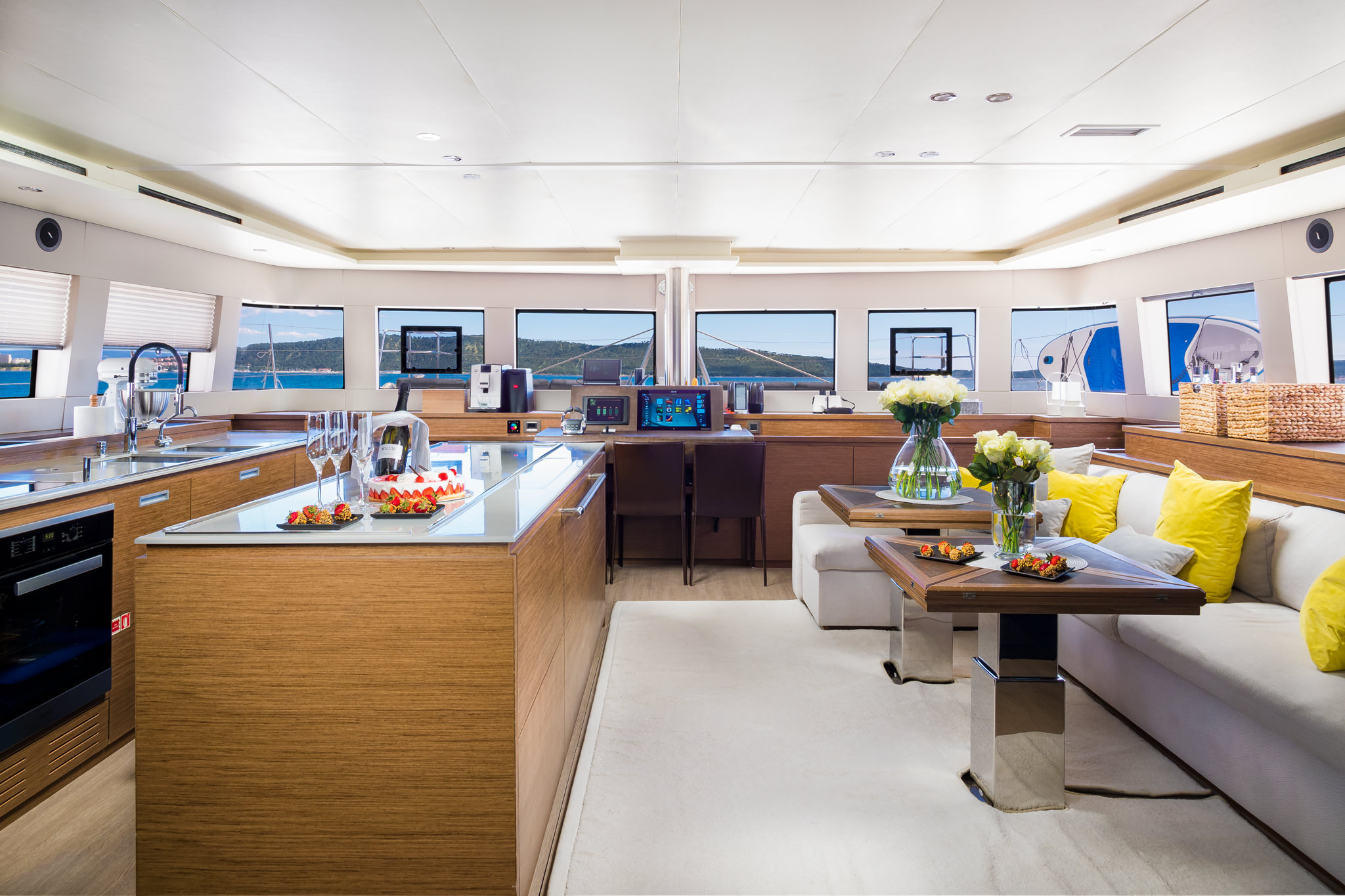 Luxury yacht Duolife catamaran lounge and dining area, kitchen and command bridge