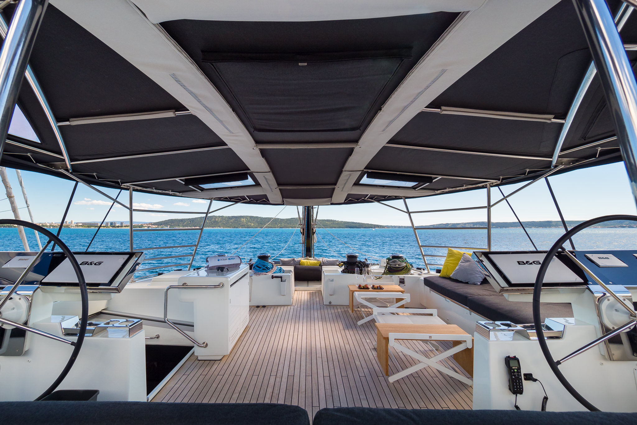 Luxury yacht Duolife catamaran 2 helms with a command bridge and a top deck covered lounge area
