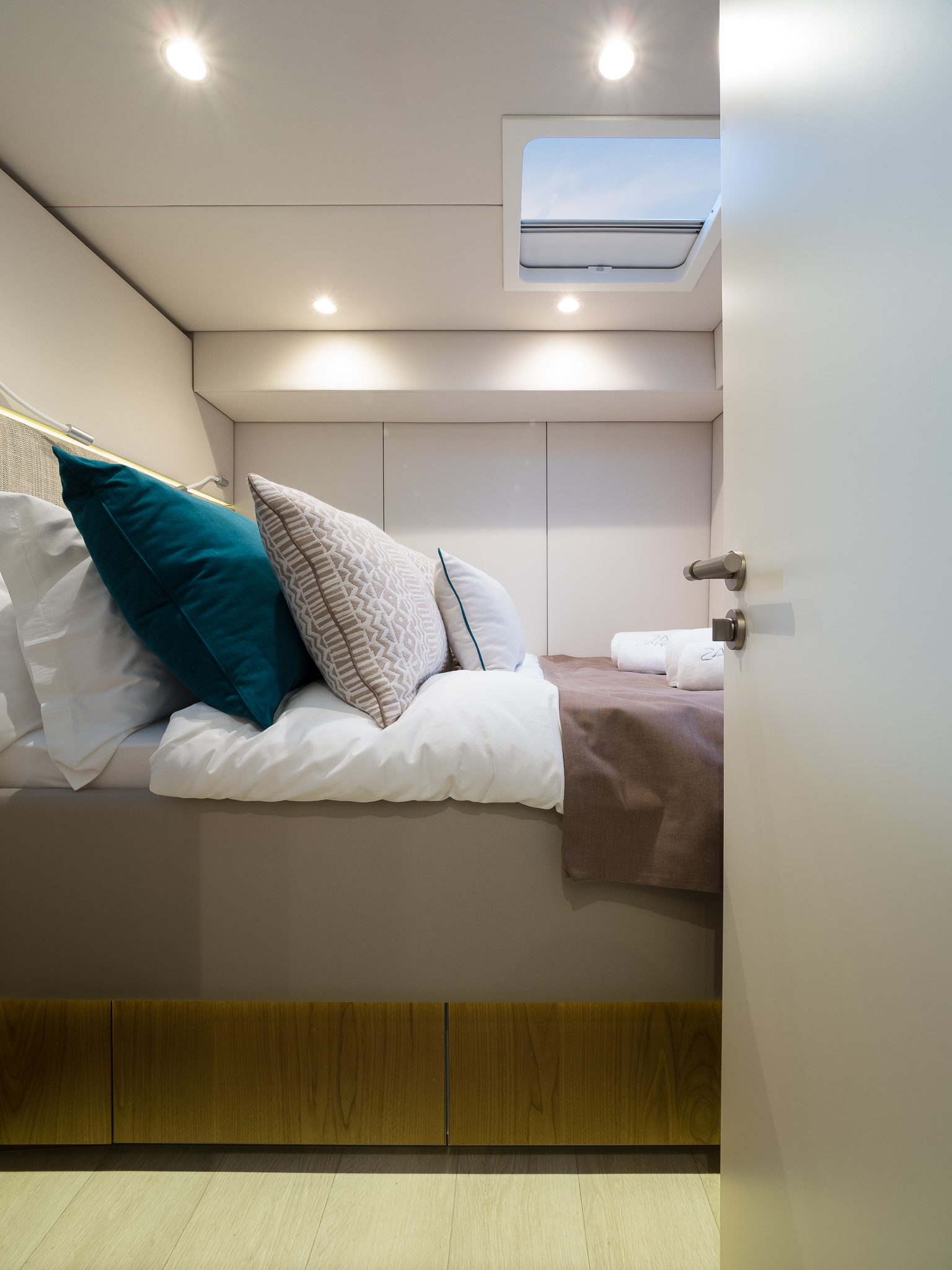 Sunreef 50 ZARA luxury catamaran smaller ensuite cabin with a double bed and a roof window