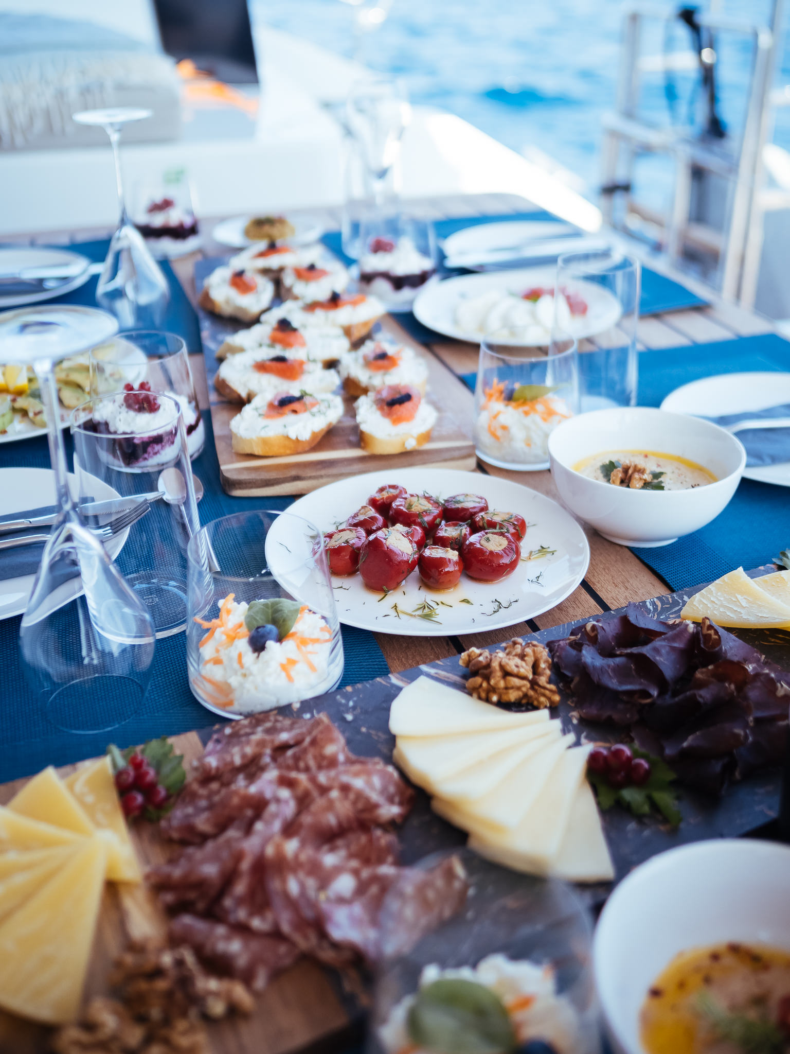 Dining table with different types of food on it.