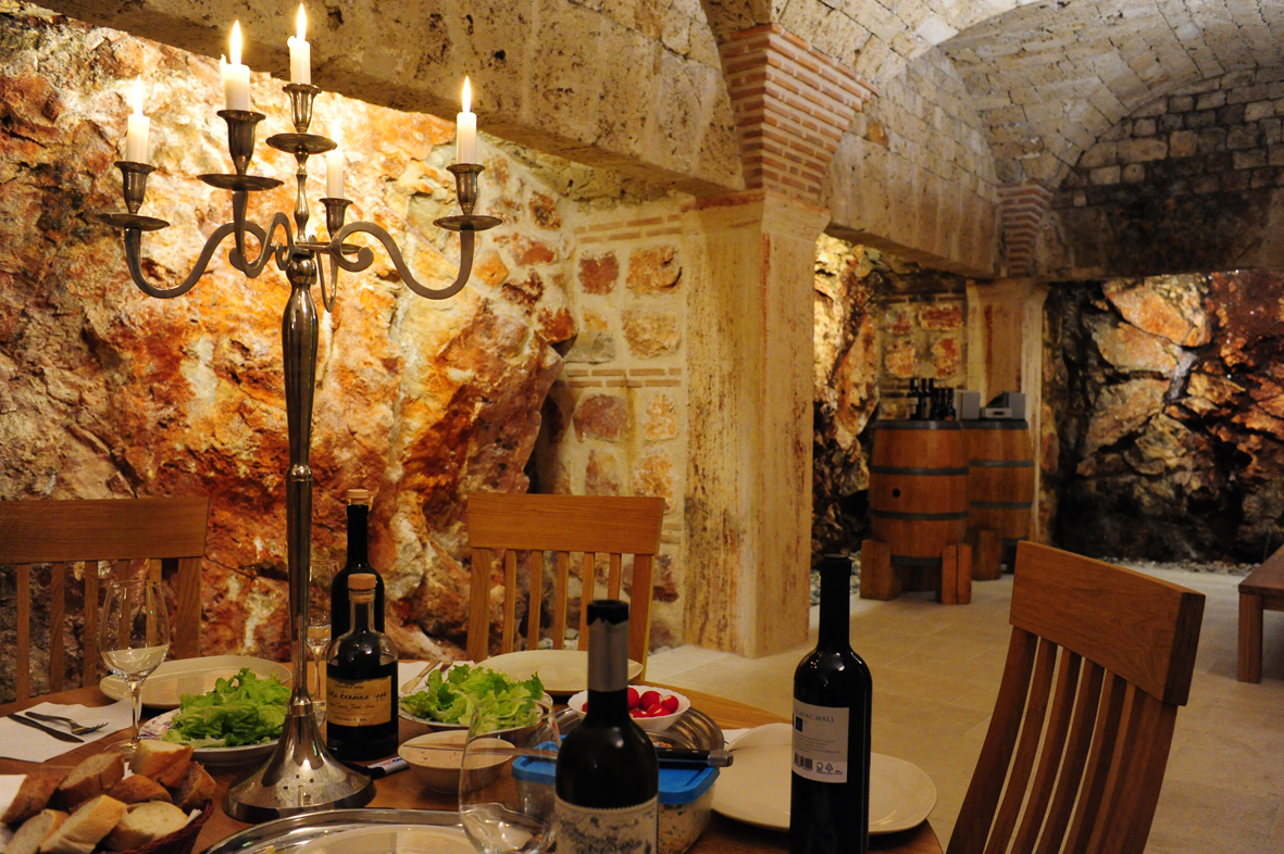 Dinner in a wine cellar.