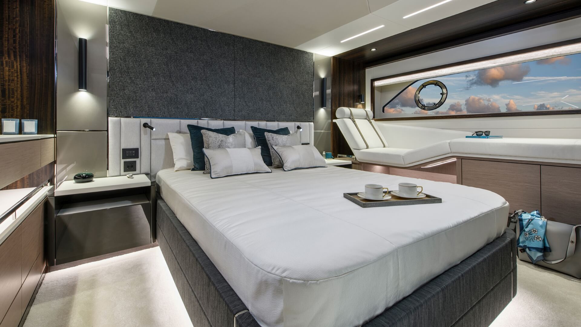 Sunseeker Manhattan 68 M/Y Apollo yacht -cabin with a double bed and a lounge area next to the big window